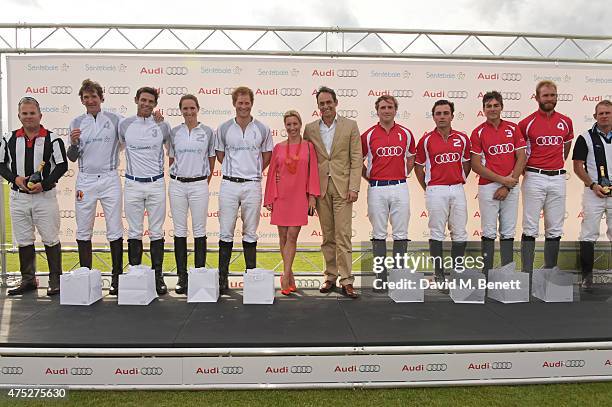 Team Ultra player Luke Tomlinson, Malcolm Borwick, Nina Clarkin and Prince Harry, Christine Seig, Andre Konsbruck, Director of Audi UK, and Team...