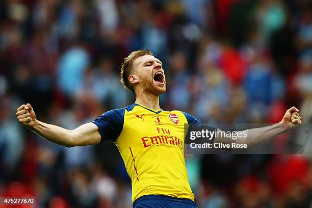 Per Mertesacker of Arsenal celebrates during the FA Cup Final between Aston Villa and Arsenal at Wembley Stadium on May 30, 2015 in London, England.