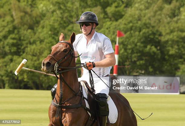 Prince Harry plays during day one of the Audi Polo Challenge at Coworth Park on May 30, 2015 in London, England.