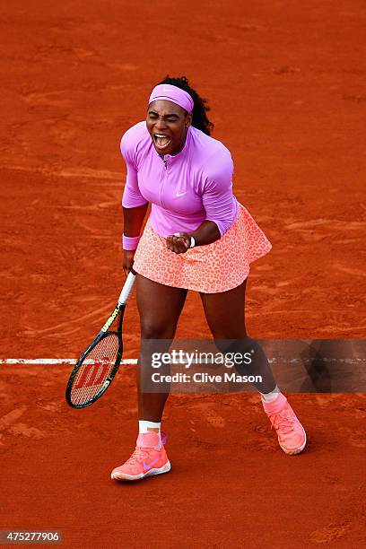 Serena Williams of the United States celebrates a point in her Women's Singles match against Victoria Azarenka of Belarus on day seven of the 2015...