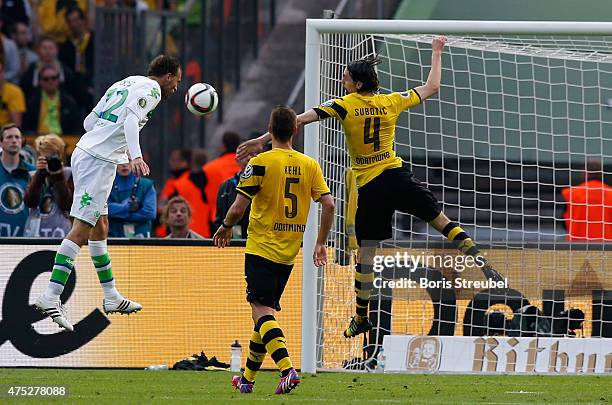 Bas Dost of Wolfsburg scores his team's third goal during the DFB Cup Final match between Borussia Dortmund and VfL Wolfsburg at Olympiastadion on...