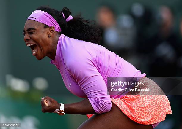 Serena Williams of the United States celebrates a point in her Women's Singles match against Victoria Azarenka of Belarus on day seven of the 2015...