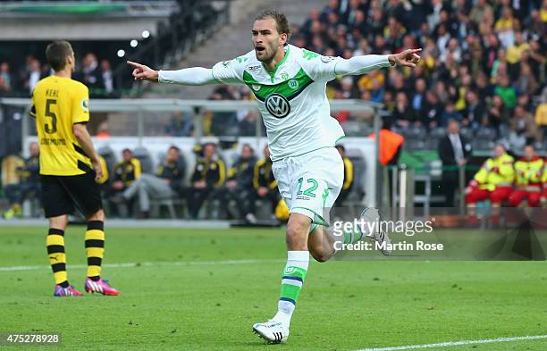 Bas Dost of VfL Wolfsburg celebrates after scoring his teams third goal during the DFB Cup Final match between Borussia Dortmund and VfL Wolfsburg at...