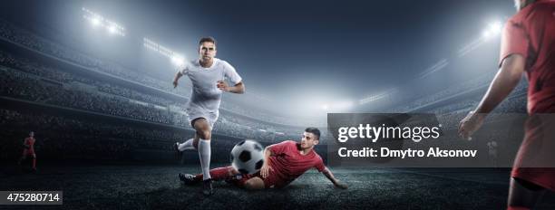 soccer player kicking ball in stadium - kicking ball stock pictures, royalty-free photos & images