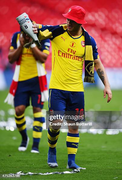 Jack Wilshere of Arsenal looks on in victory after the FA Cup Final