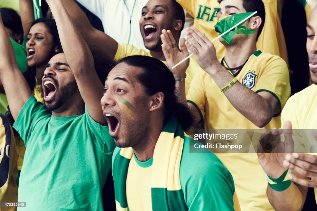 Crowd of Brazilian fans cheering