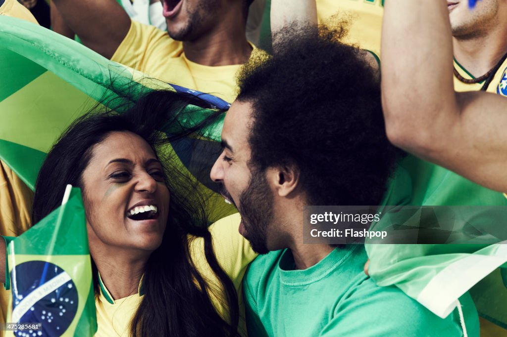 Crowd of Brazilian fans cheering