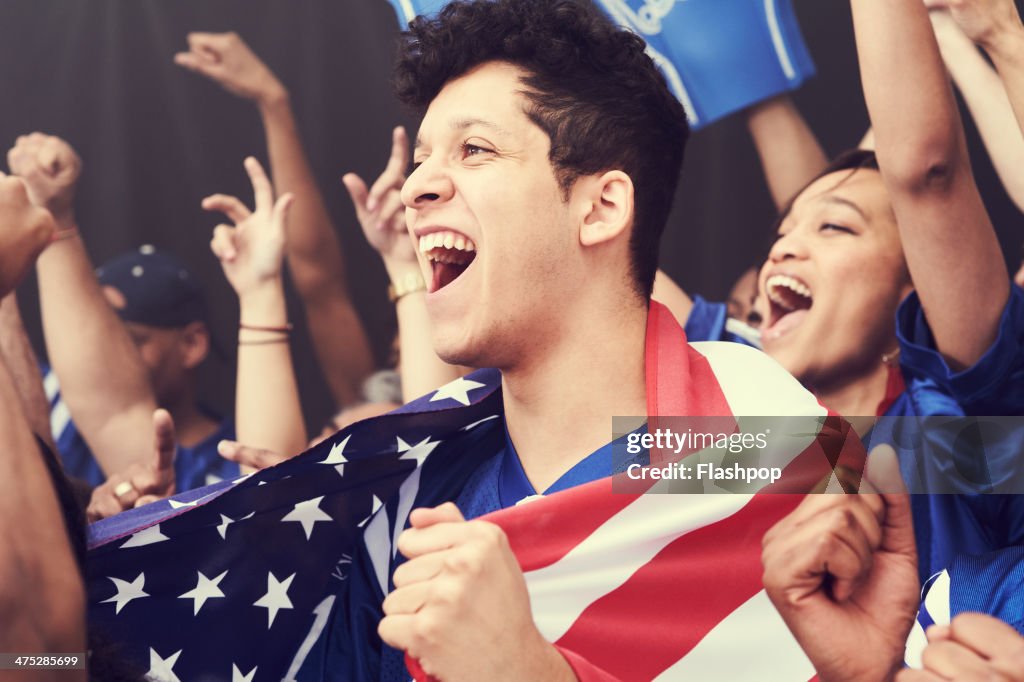 Crowd of sports fans cheering