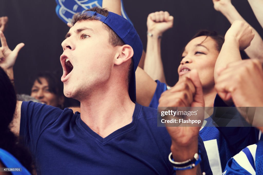Crowd of sports fans cheering