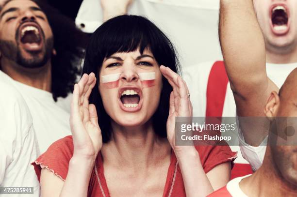 crowd of england fans at sporting event - face paint stock pictures, royalty-free photos & images