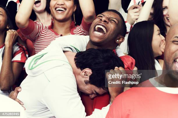 crowd of england fans at sporting event - cheering stock pictures, royalty-free photos & images