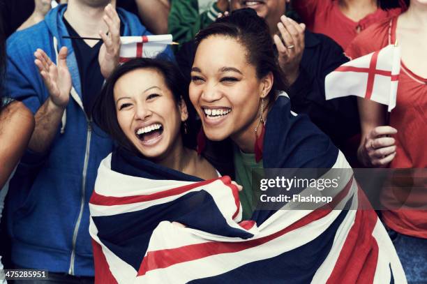 crowd of england fans at sporting event - asian flags ストックフォトと画像