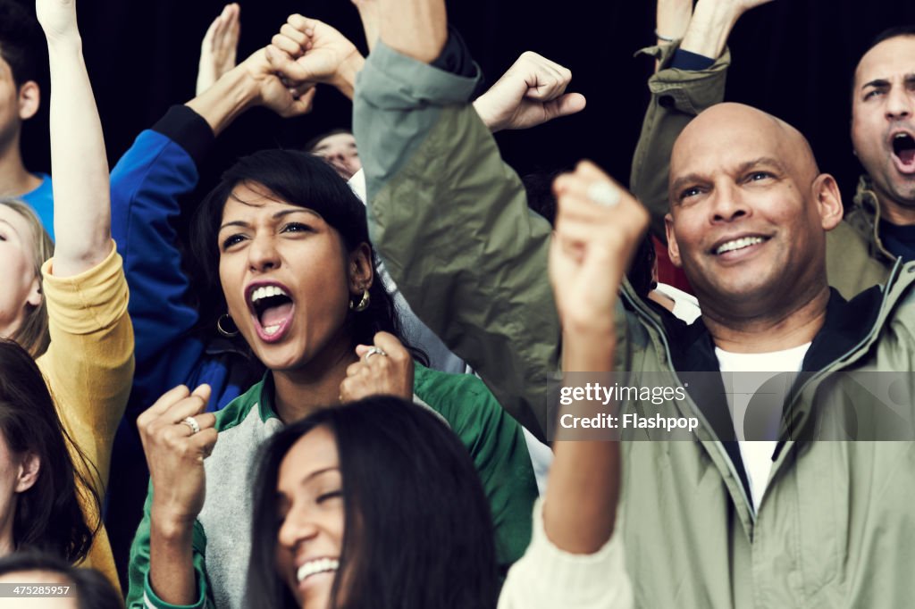 Crowd of sports fans cheering