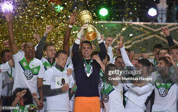 Diego Benaglio of VfL Wolfsburg lifts the trophy after his teams victory in the DFB Cup Final match between Borussia Dortmund and VfL Wolfsburg at...