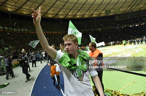 Wolfsburg's Belgian midfielder Kevin De Bruyne celebrates after the German Cup DFB Pokal final football match between BVB Borussia Dortmund and VfL...