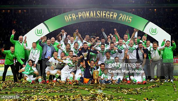 The team of VfL Wolfsburg celebrates victory after the DFB Cup Final match between Borussia Dortmund and VfL Wolfsburg at Olympiastadion on May 30,...