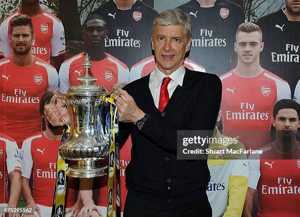 Arsenal manager Arsene Wenger with the FA Cup after the FA Cup Final between Aston Villa and Arsenal at Wembley Stadium on May 30, 2015 in London,...