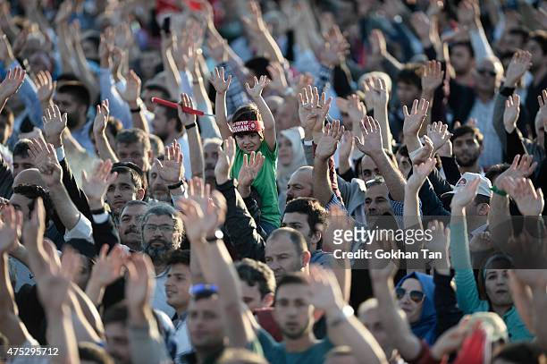 Supporters of Turkish President Tayyip Erdogan and Prime Minister and leader of the ruling Justice and Development Party Ahmet Davutoglu wave...