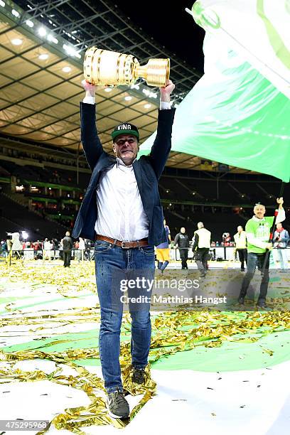 Head coach Dieter Hecking of VfL Wolfsburg celebrates with the trophy after his teams victory in the DFB Cup Final match between Borussia Dortmund...