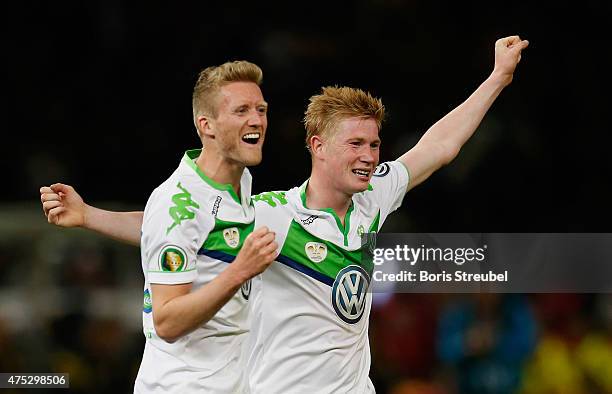 Andre Schuerrle and Kevin De Bruyne of Wolfsburg celebrate after winning the DFB Cup Final match between Borussia Dortmund and VfL Wolfsburg at...