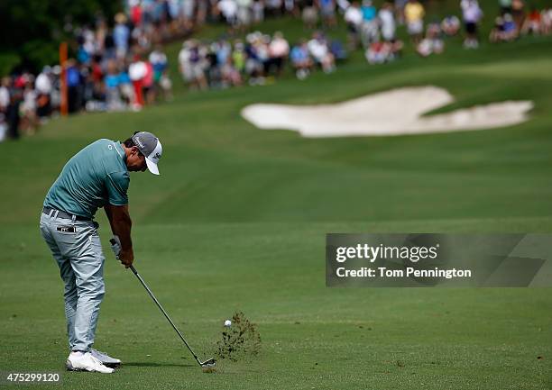 Jon Curran hits his approach shot on the first hole during Round Three of the AT&T Byron Nelson at the TPC Four Seasons Resort Las Colinas on May 30,...