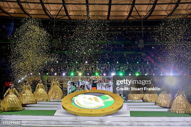 Captain Diego Benaglio of Wolfsburg lifts the trophy to celebrate with his team mates after winning the DFB Cup Final between Borussia Dortmund and...