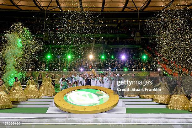 Captain Diego Benaglio of Wolfsburg lifts the trophy to celebrate with his team mates after winning the DFB Cup Final between Borussia Dortmund and...