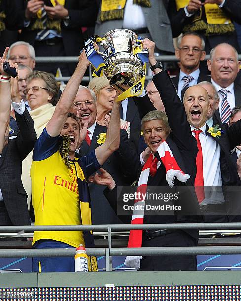 Nacho Monreal and Arsene Wenger the manager of Arsenal lift the FA Cup after the match between Arsenal and Aston Villa in the FA Cup Final at Wembley...