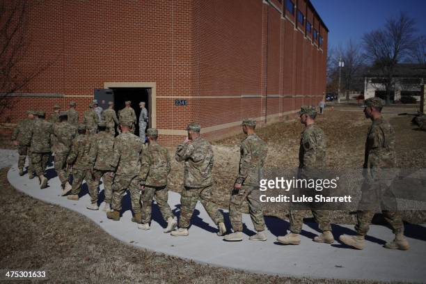 Soldiers from the U.S. Army's 3rd Brigade Combat Team, 1st Infantry Division, arrive at a homecoming ceremony in the Natcher Physical Fitness Center...
