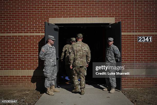 Soldiers from the U.S. Army's 3rd Brigade Combat Team, 1st Infantry Division, arrive at a homecoming ceremony in the Natcher Physical Fitness Center...