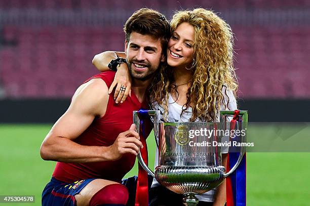 Gerard Pique of FC Barcelona and Shakira pose with the trophy after FC Barcelona won the Copa del Rey Final match against Athletic Club at Camp Nou...