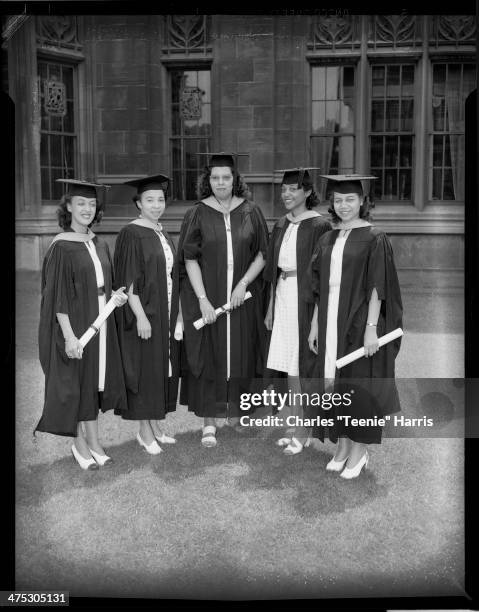 University of Pittsburgh graduates Genevieve Howard, Alberta W Brown, Jean Williams, Marilyn Duncan, and Miss Womack, posed with diplomas in front of...