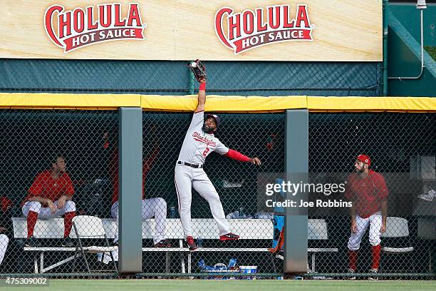 Denard Span of the Washington Nationals is unable to catch a ball hit by Todd Frazier of the Cincinnati Reds in the eighth inning of the game at...