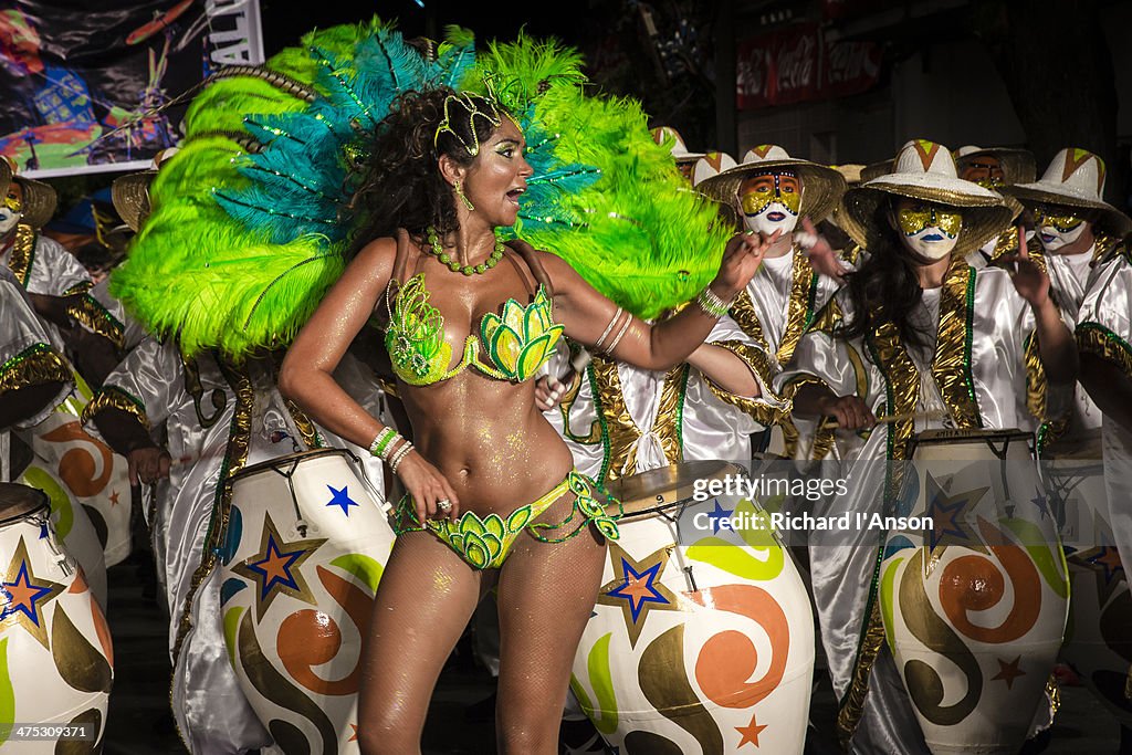 Woman in costume & headdress in Carnaval parade