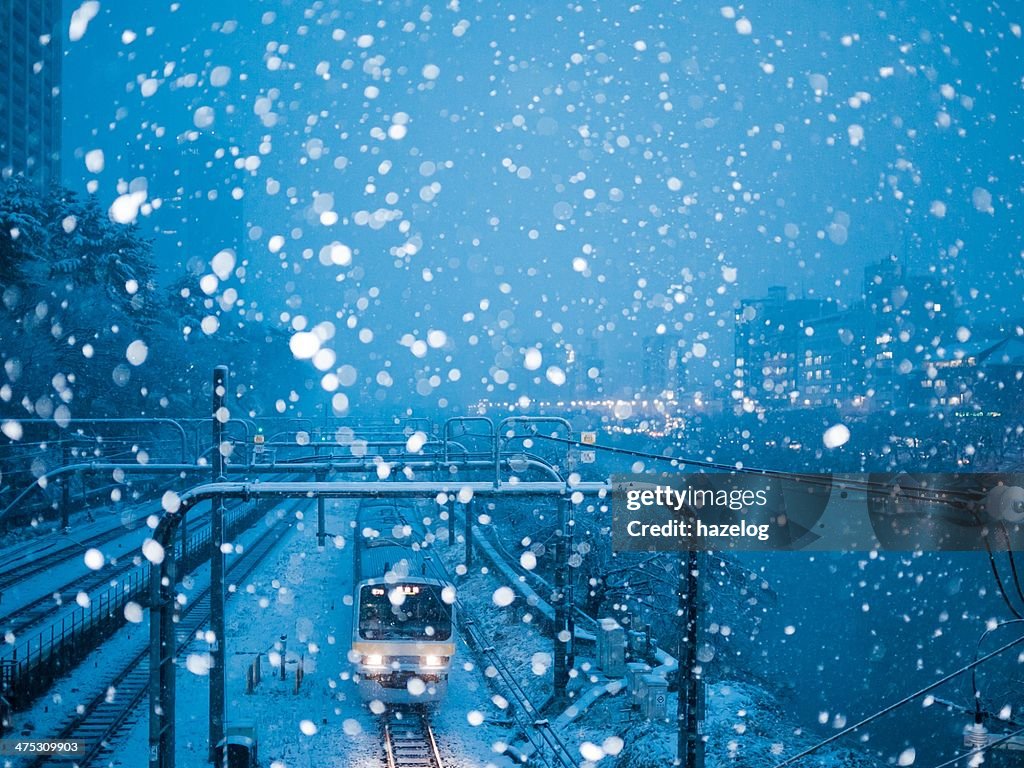 Train running in heavy snow night