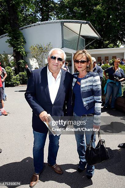 Dominique Strauss-Khan and Myriam L'Aouffir attend the French Open at Roland Garros on May 30, 2015 in Paris, France.