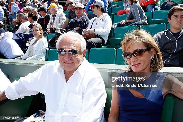 Dominique Strauss-Khan and Myriam L'Aouffir attend the French Open at Roland Garros on May 30, 2015 in Paris, France.