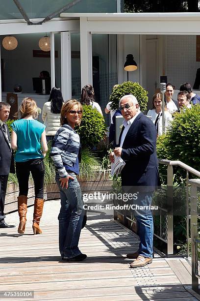 Dominique Strauss-Khan and Myriam L'Aouffir attend the French Open at Roland Garros on May 30, 2015 in Paris, France.