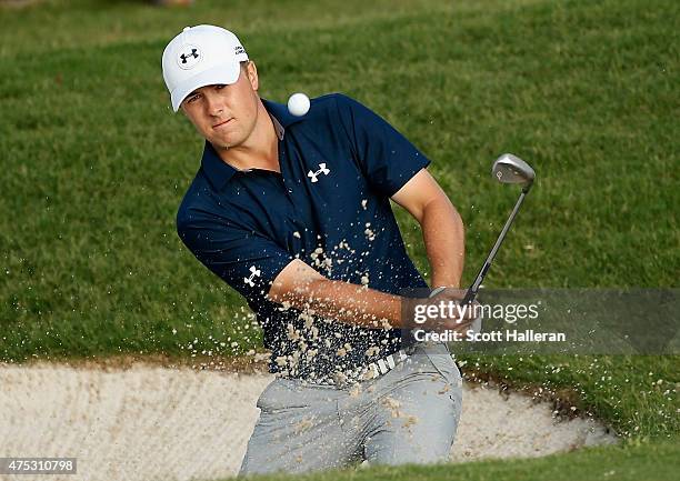 Jordan Spieth plays a bunker shot on the 15th hole during Round Three of the AT&T Byron Nelson at the TPC Four Seasons Resort Las Colinas on May 30,...
