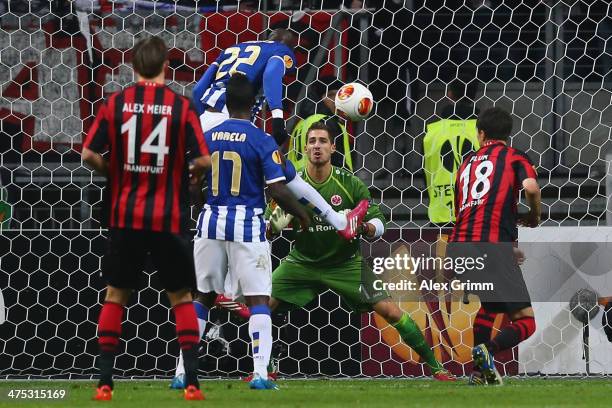 Eliaquim Mangala of Porto scores his team's second goal against goalkeeper Kevin Trapp of Frankfurt during the UEFA Europa League Round of 32 second...