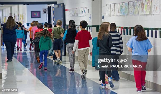 Students walking the hallways are seen February 21 at Steuart W. Weller Elementary School in Ashburn, Virginia AFP PHOTO/Paul J. Richards