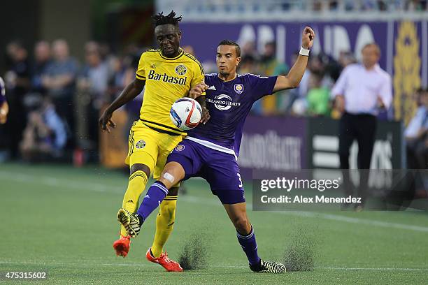 Kei Kamara of Columbus Crew and Seb Hines of Orlando City SC fight for the ball during a MLS soccer match between the Columbus Crew and the Orlando...