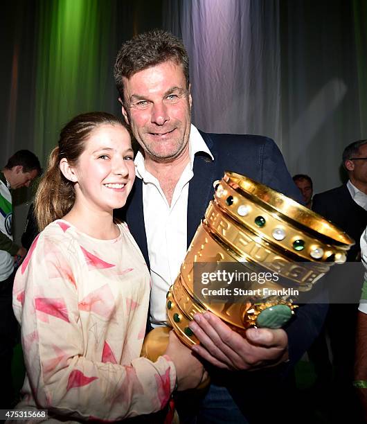 Head coach Dieter Hecking poses with his daughter Charlotte during the VfL Wolfsburg Champions party after winn;ing the German DFB Cup Final at...