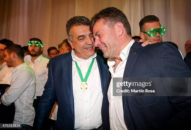 Head coach Dieter Hecking poses with Francisco Javier Garcia Sanz , Chairman of Volkswagen Group during the VfL Wolfsburg Champions party after...