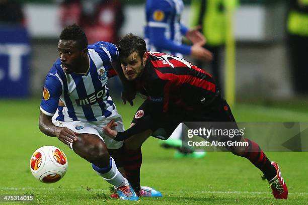 Silvestre Varela of Porto is challenged by Tranquillo Barnetta of Frankfurt during the UEFA Europa League Round of 32 second leg match between...