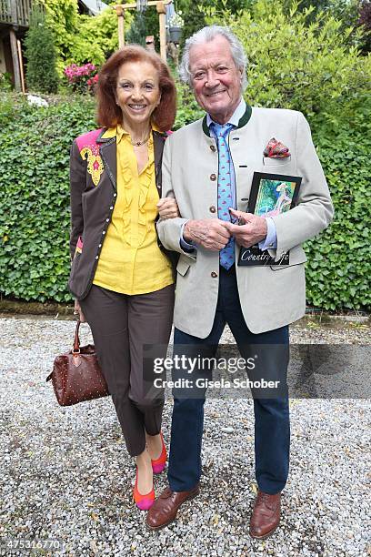 Toni Meggle and his wife Marina Meggle during the Mauro Bergonzoli Country Life Studio Opening on May 30, 2015 in Kirchheim, Germany.