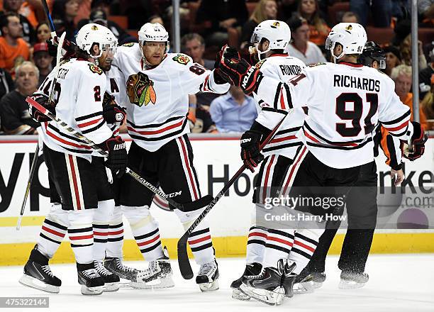 Marian Hossa of the Chicago Blackhawks celebrates his second period goal with teammates against the Anaheim Ducks in Game Seven of the Western...