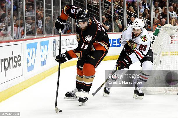 Patrick Maroon of the Anaheim Ducks with the puck against Kyle Cumiskey of the Chicago Blackhawks in the third period in Game Seven of the Western...