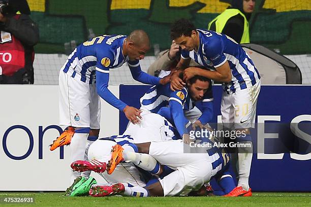 Nabil Ghilas of Porto celebrates his team's third goal with team mates during the UEFA Europa League Round of 32 second leg match between Eintracht...