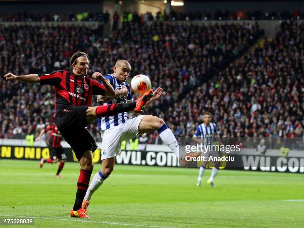 Alexander Meier of Frankfurt vies for the ball with Maicon of Porto during the UEFA Europa League round of 32 second leg soccer match between...